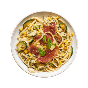 Pâtes au maïs, prosciutto & courgettes