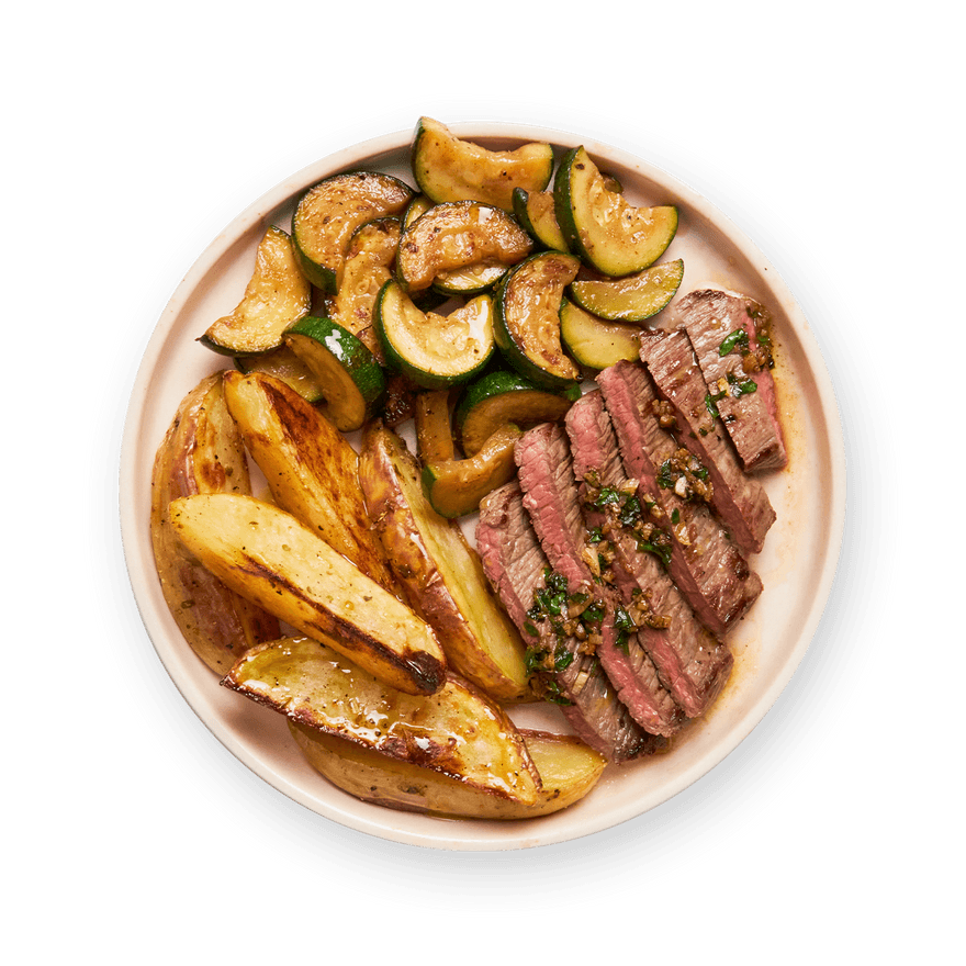 Steak au beurre d'ail, pommes de terre & courgettes